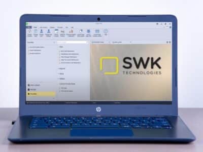 A Sage 100 screen on a laptop displaying the SWK Technologies, a trusted Sage ERP cloud hosting provider.