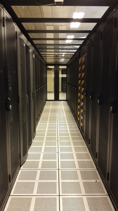 A gap between server racks representing infrastructure hosting storage for Sage 100