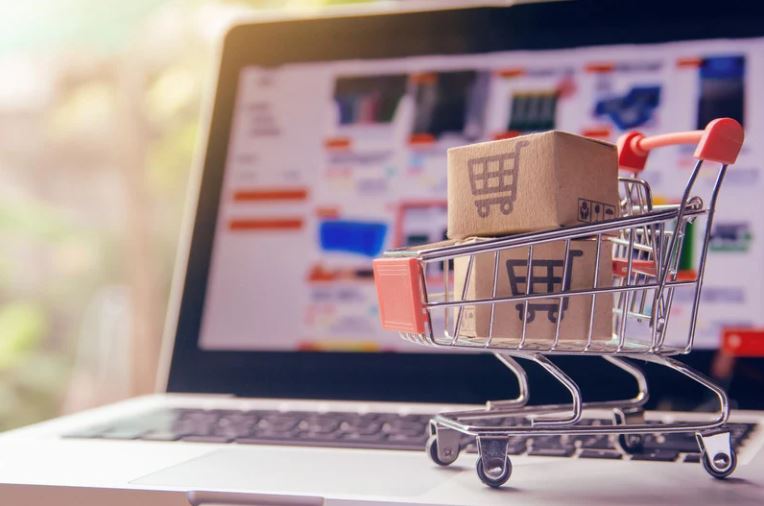 Acumatica Shopify, Shopping Cart in Front of Computer