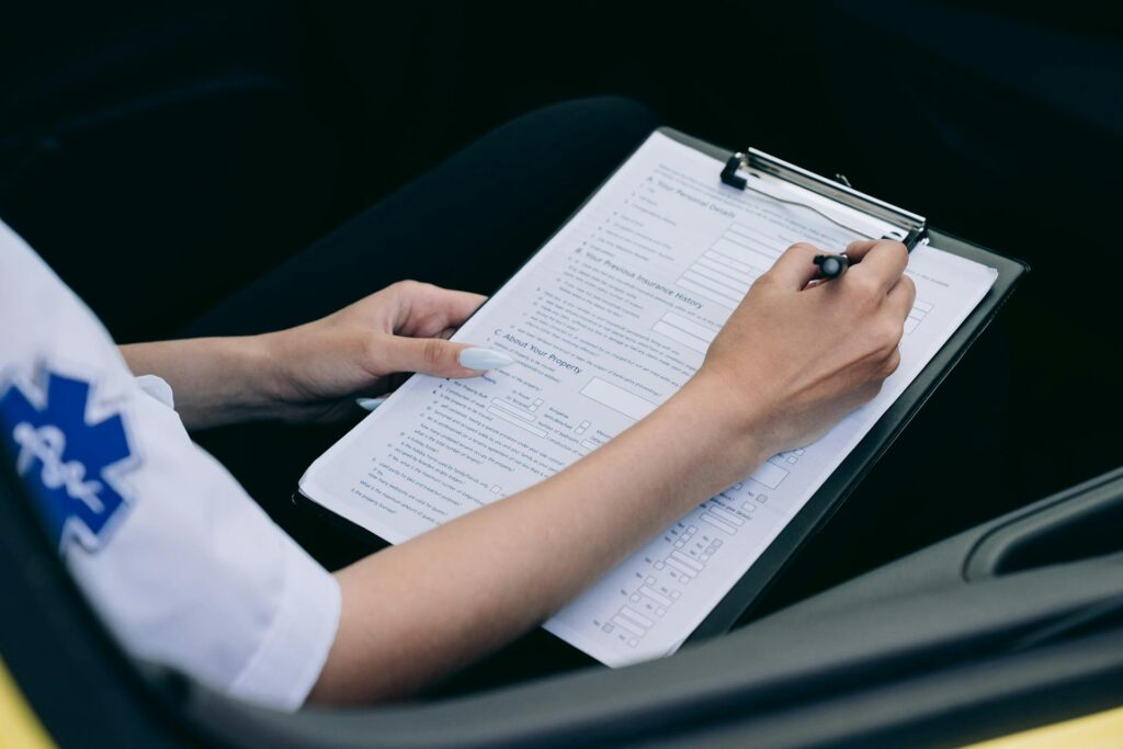 Healthcare professional in medical uniform filling out report, including HIPAA compliant information that will be submitted to an ERP such as Sage Intacct