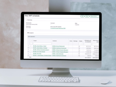 A Sage Intacct 2024 R4 Construction WIP schedule screen showing project details including customer names, estimated costs, and total contract values displayed on an iMac monitor against a light background.