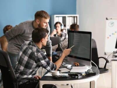 Predictable IT. Man sitting at computer