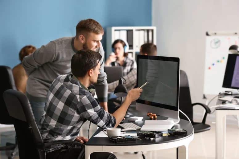 Predictable IT. Man sitting at computer